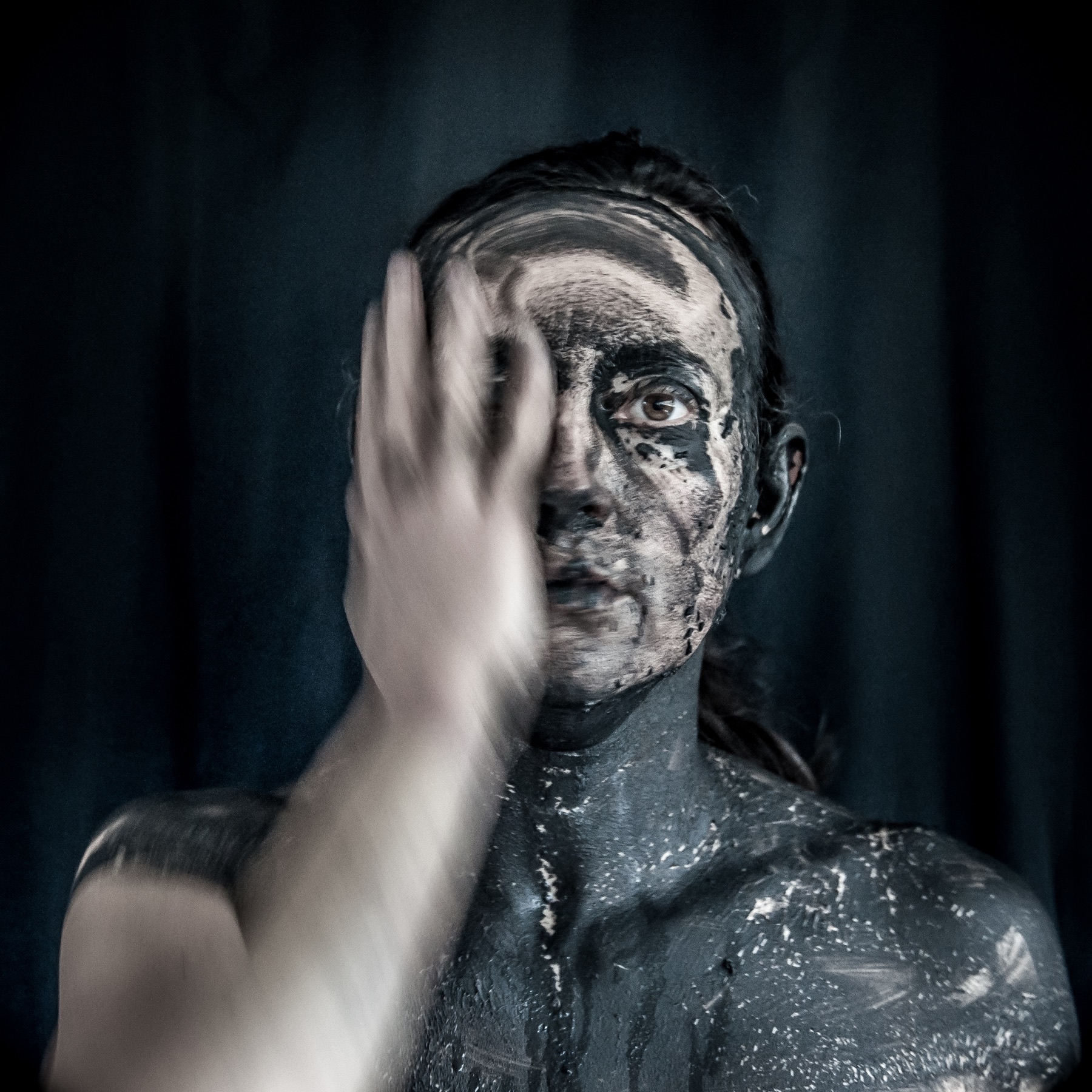 Still from Dis-appear: face and moving hand