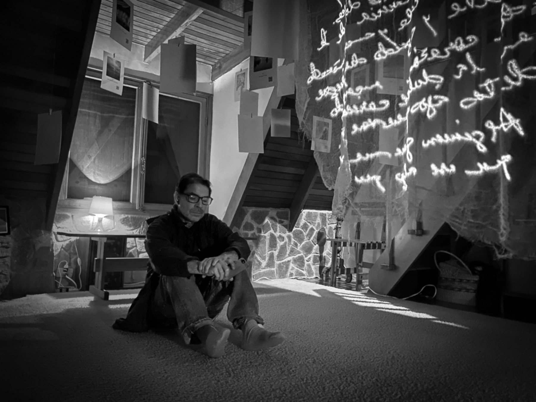A visitor contemplating the projected writing in Ella